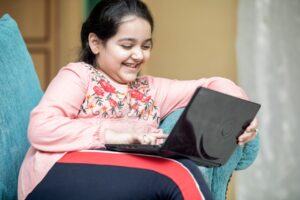 A Girl Using a Laptop